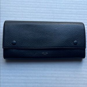 Celine Wallet with neon yellow interior and back pocket.